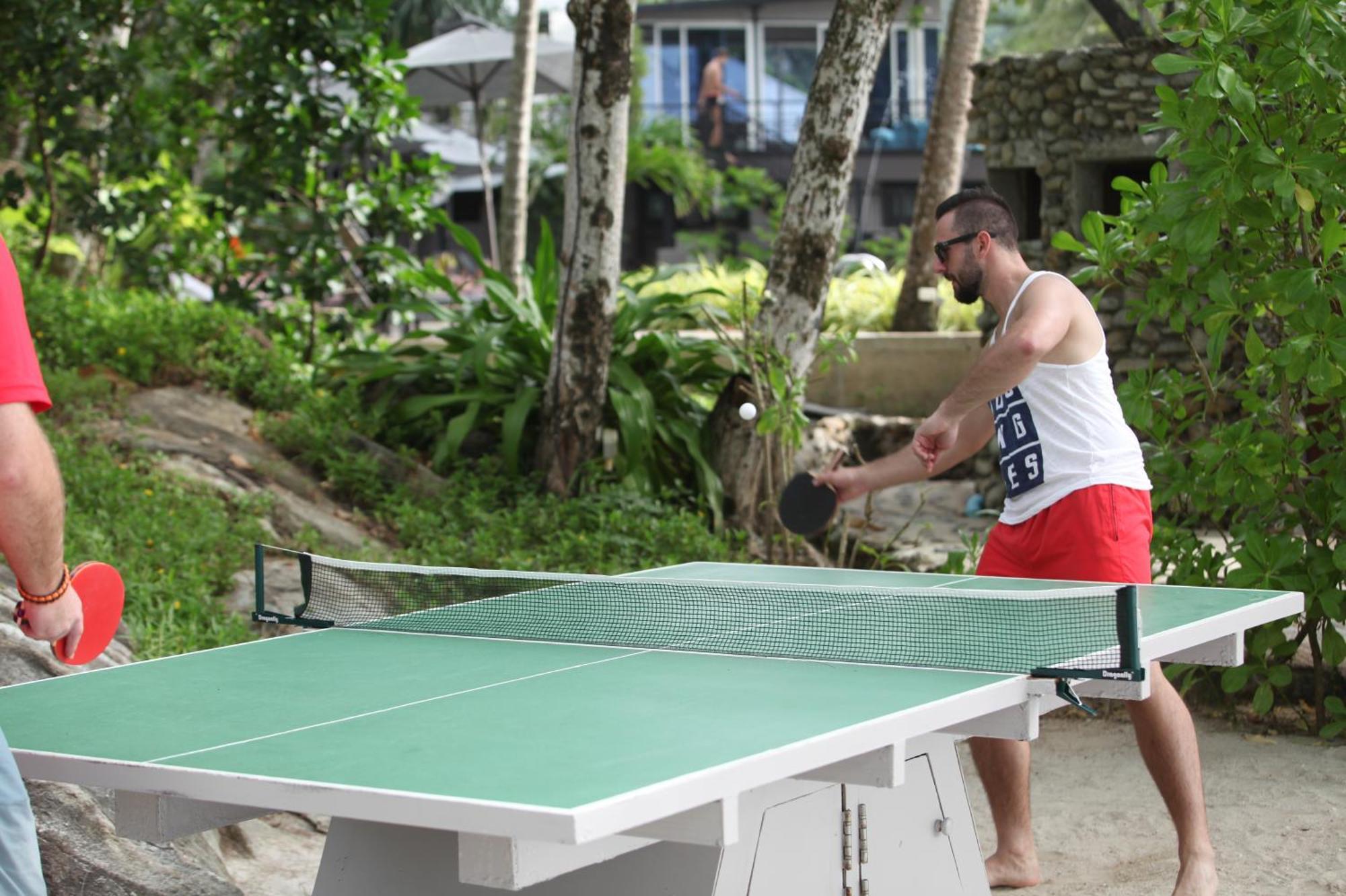 Moracea By Khao Lak Resort Екстериор снимка A table tennis player